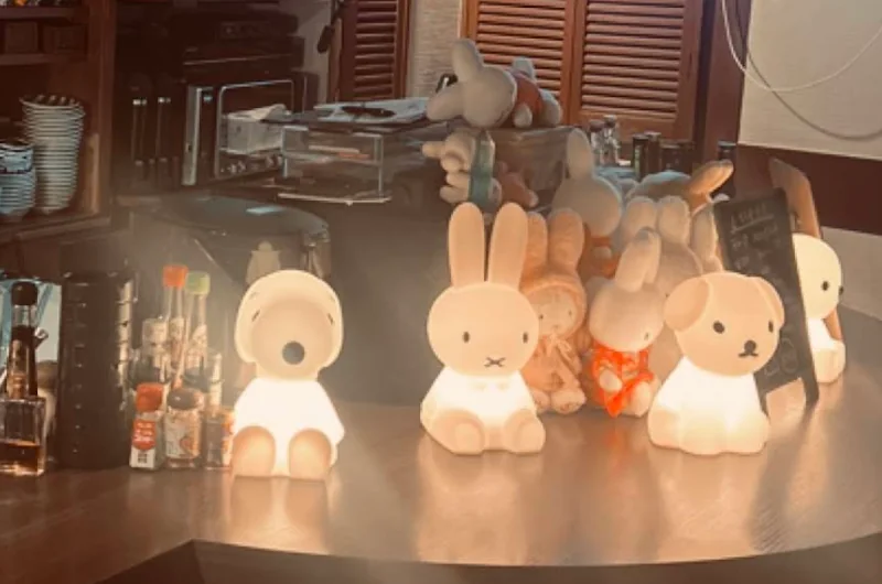 Shelves, drinks and Miffy figures inside Shinjuku Dee